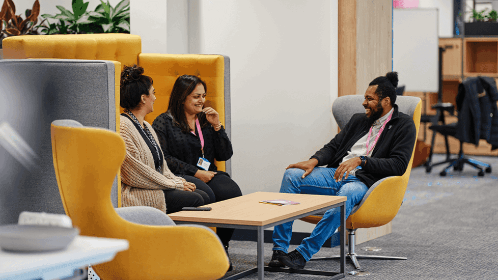 Colleagues having a conversation and smiling
